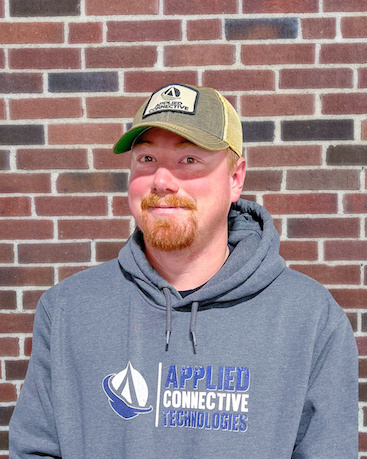Audio/video technician Blake Olnes of Applied Connective Technologies