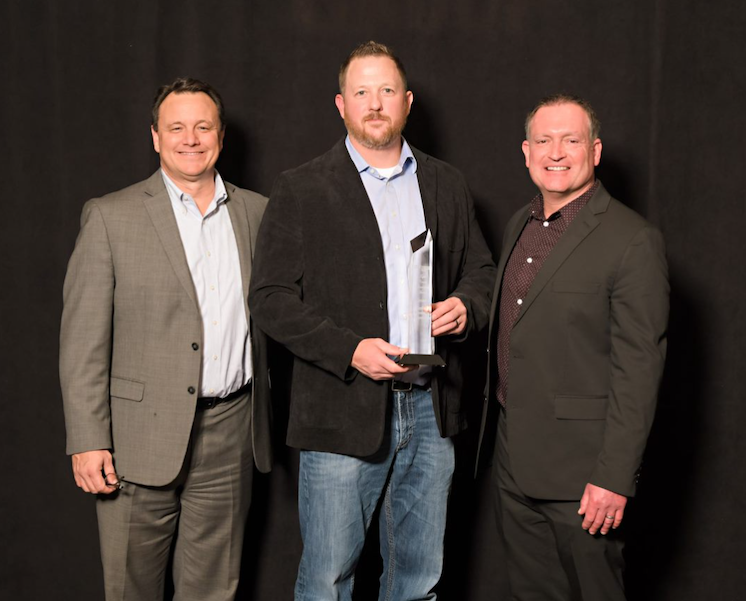 Ed Knott of Applied Connective Technologies accepts a prestigious national award at annual conference for IT professionals view